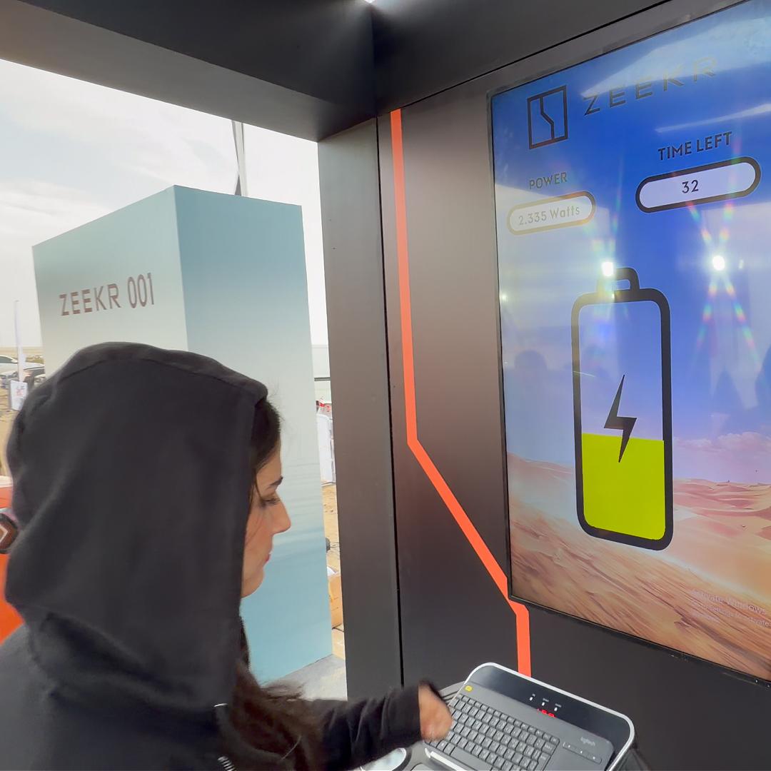 Interactive Treadmill Activation in Dubai: Participants generating human power to recharge EV cars